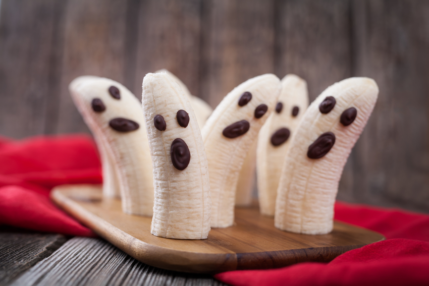 Bananas have chocolate chip faces that make them look like ghosts.